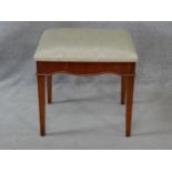 A Georgian yew dressing stool with damask upholstered seat on square tapering supports. H.49 L.48