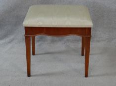 A Georgian yew dressing stool with damask upholstered seat on square tapering supports. H.49 L.48