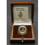 A cased Elizabeth II Britannia ten pounds gold coin, the 1/10 ounce fine gold coin dated 1989 with