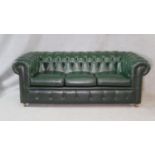 A three seater Chesterfield sofa in deep buttoned upholstery. H.70 W.200 D.92cm