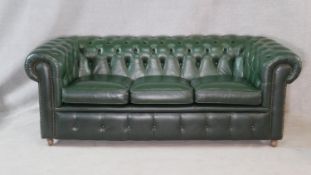 A three seater Chesterfield sofa in deep buttoned upholstery. H.70 W.200 D.92cm