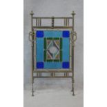 A 19th century brass fire screen with coloured leaded glass inset panel. H.87 W.50cm