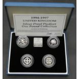 A Royal Mint One Pound Silver Proof Piedfort one pound coin set 1994 - 1997. In pale blue leather