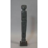 A carved stone statue of a female figure on a square stand. Titled 'Goddess' by M Shoebridge.