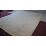 A large 1960's vintage off-white tufted wool carpet. L.340 W.285cm