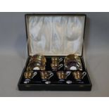 A six person Aynsley cobalt and gold floral design coffee set with six silver and guilloche Royal