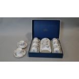A Royal Worcester June Garland, six person coffee set, boxed with two spare cups and saucers (one