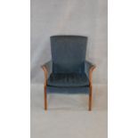 A mid century Parker Knoll armchair in original upholstery. H.82cm