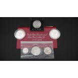 A collection of silver coins. Including a 1976 US uncirculated Silver proof Bicentennial 3 Coin Set,
