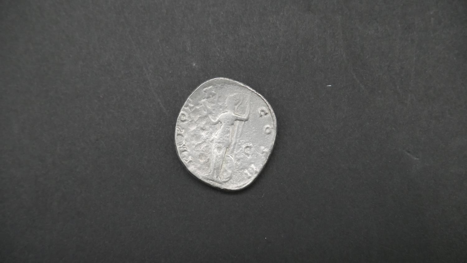 Four ancient Roman coins. Including an ancient roman silver coin depicting Securitas seated on a - Image 2 of 9