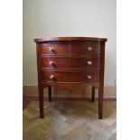 A small late Georgian bowfronted mahogany chest of three drawers with crossbanded and satinwood