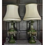 A large pair of swag carved painted and gilt table lamps and shades. H.110cm W.30cm