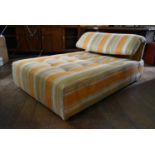A Roche Bobois chaise in soft candy stripe buttoned upholstery with bolster cushion. H.60 L.140 W.