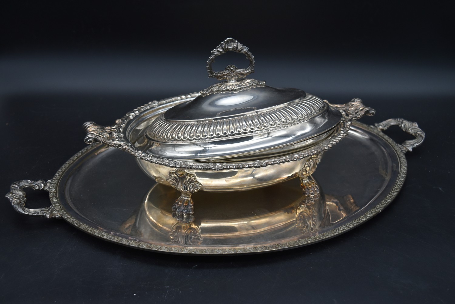 A large twin handles silver plated tray and a serving tureen with hotplate and cover. L.60cm (tray)