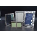 A collection of four silver easel picture frames, various English hallmarks. H.28cm W.20cm (largest)