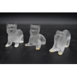 Three Lalique frosted glass figures of Yorkshire Terrier dogs, one standing, one sitting and one