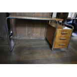 After Marcel Breuer, a B91 type pedestal desk in walnut and burr walnut with inset glass top with