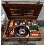 A vintage games compendium to include chess, draughts, backgammon, dominos and roulette in fitted