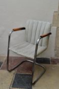 A vintage armchair on chrome cantilever base. H.83 W.53cm