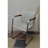 A vintage armchair on chrome cantilever base. H.83 W.53cm