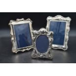 A collection of three silver easel picture frames, various English hallmarks. H.26cm W.20cm (