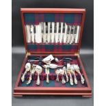 A silver plated canteen of cutlery by Arthur Price in fitted inlaid mahogany box. Twelve piece