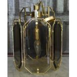 A brass framed hexagonal ceiling light pendant with glass panel sides. H.36cm W.30cm