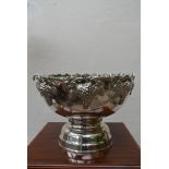 A silver plated wine cooler with fitted interior and grape and vine decoration to the rim. H.30 W.