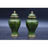 A pair of Chinese cloisonné lidded vases with all over floral enamel decoration. H.23cm