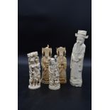 Three early 20th century Chinese carved ivory figures and a similar pair of moulded figures. H.