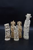 Three early 20th century Chinese carved ivory figures and a similar pair of moulded figures. H.