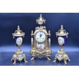 A French style brass cased clock garniture with urn finial and blue glaze with decorative panels