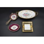 Limoges; two matching hand gilded and decorated ormolu mounted dressing table trays, a similar