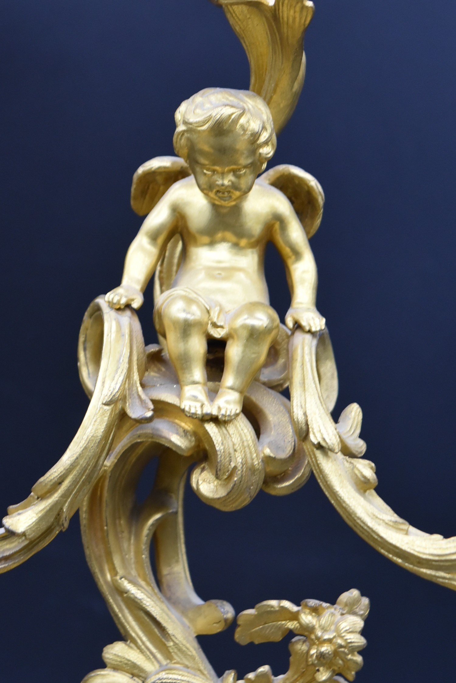 A pair of gilt metal three branch table candelabras with cherub surmounts raised on Rococo scrolling - Image 4 of 5