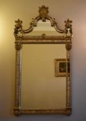 An early Georgian style pier mirror with Rococo shell cresting and with the plate flanked by