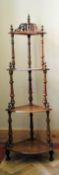 A Victorian burr walnut and satinwood floral inlaid four tier corner whatnot on turned supports. H.