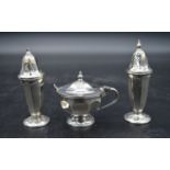 A cased silver cruet set, mustard pot and spoon and salt and pepper shakers. EV for Viners Ltd,