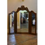 A large carved French style triple mirror. H.130cm W.130cm