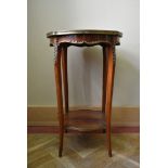 A 19th century Louis XV style walnut lamp table or urn stand with shaped brass bound marble top on