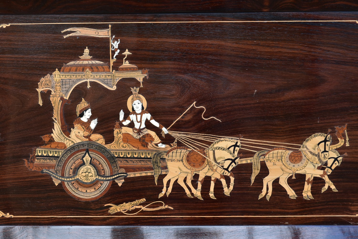 An inlaid Eastern rosewood panel depicting a couple in a ceremonial carriage in a rosewood frame. - Image 3 of 4