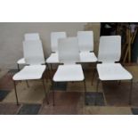 A set of six painted laminated dining chairs on tubular chrome bases. H.90 W.42cm