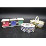 A Continental porcelain hand gilded and decorated lidded caddy, a twin lidded Spode basket and a set