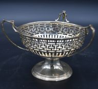 A Victorian silver bob bon dish with triple handles and pierced Greek key fret decoration,