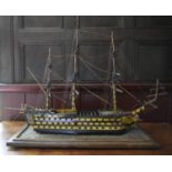 A scratch built model of the H.M.S. Victory fully rigged and detailed throughout on oak base. H.57