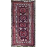 An Eastern rug with repeating gul medallions contained by multiple geometric borders. L.160 W.90cm