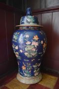 A large Chinese lidded temple jar with all over lotus flower, crane and dragonfly decoration. H.84cm