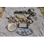 An extensive collection of silver plated items to include a set of four galleried trays, a pair of