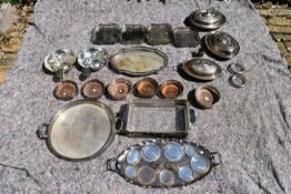 An extensive collection of silver plated items to include a set of four galleried trays, a pair of