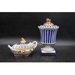 A Continental lidded urn and pierced lidded dish, both with fruit finials and hand gilded and