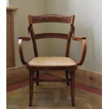 A 19th century bentwood armchair stamped J & J Kohn to the underside. H.80cm W.60cm